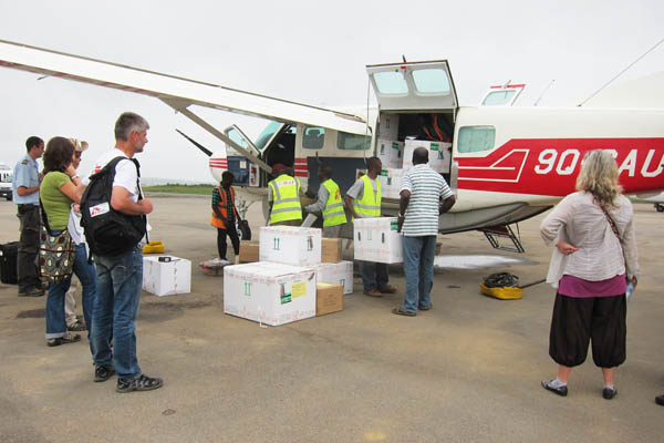 Loading cargo on a Cessna 208 Caravan I at Bunia Murongo Airport